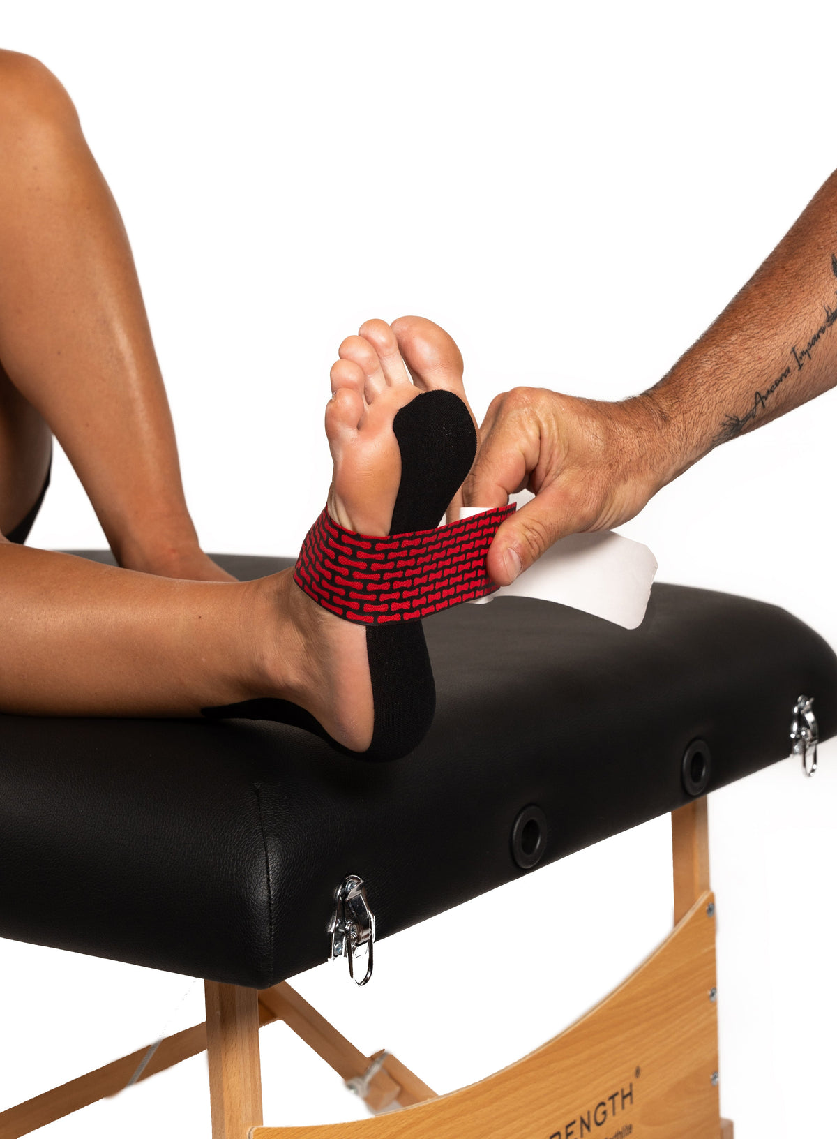 RockTape RHEON kinesiology tape applied to the foot and ankle