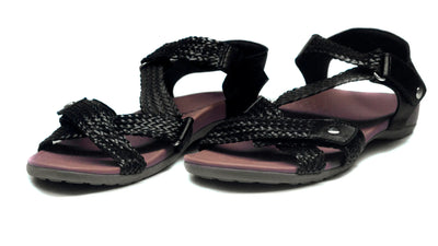 Black sandals with braided design on a white background