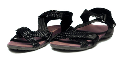 Black sandals with braided design on a white background