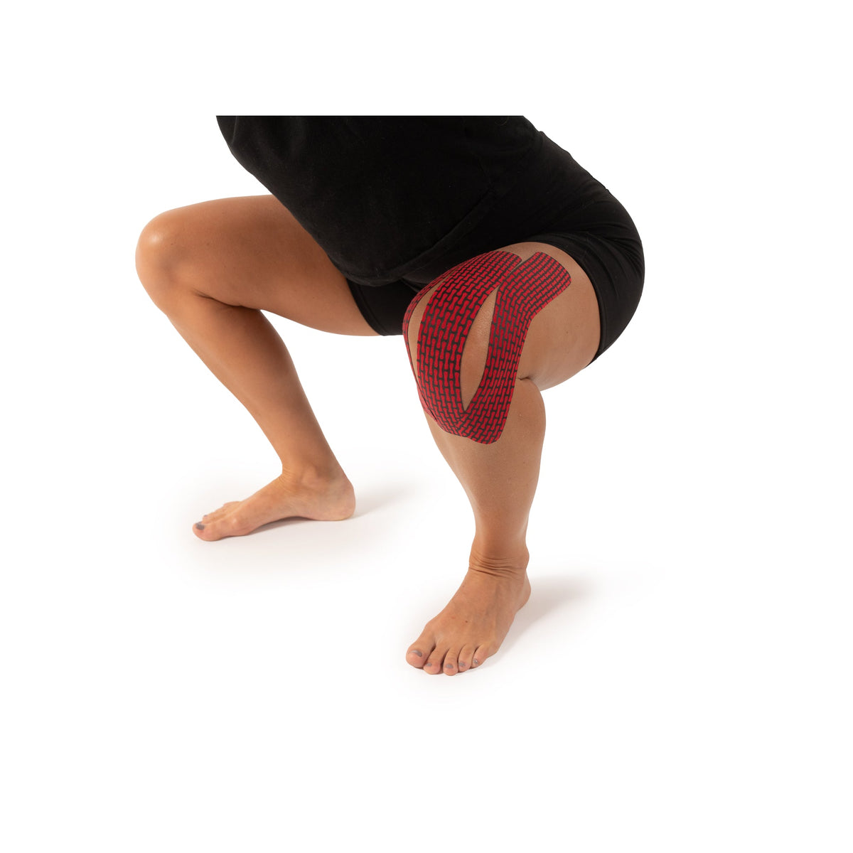 RockTape RHEON kinesiology tape supporting the knee during a squat